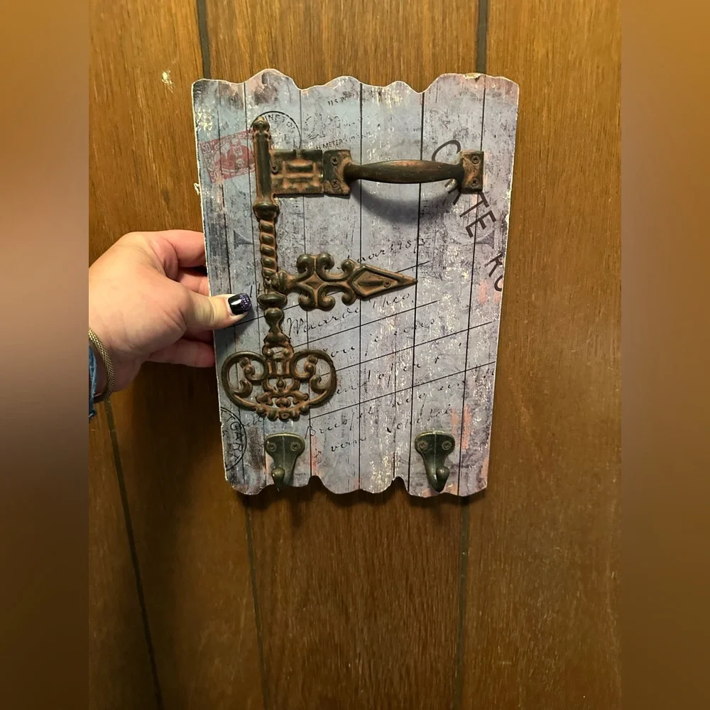 Vintage key wall decor with hooks on it